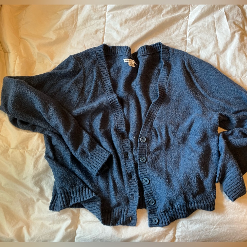 Soft, cropped blue cardigan.